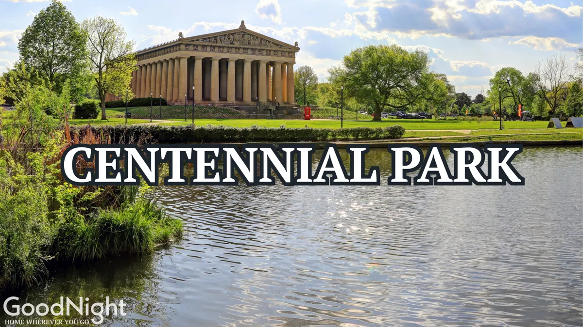 This image captures the iconic Parthenon structure set against calm water and lush greenery within Centennial Park. The pathway winding through the park suggests inviting spaces for walking, picnicking, and exploration for all ages.